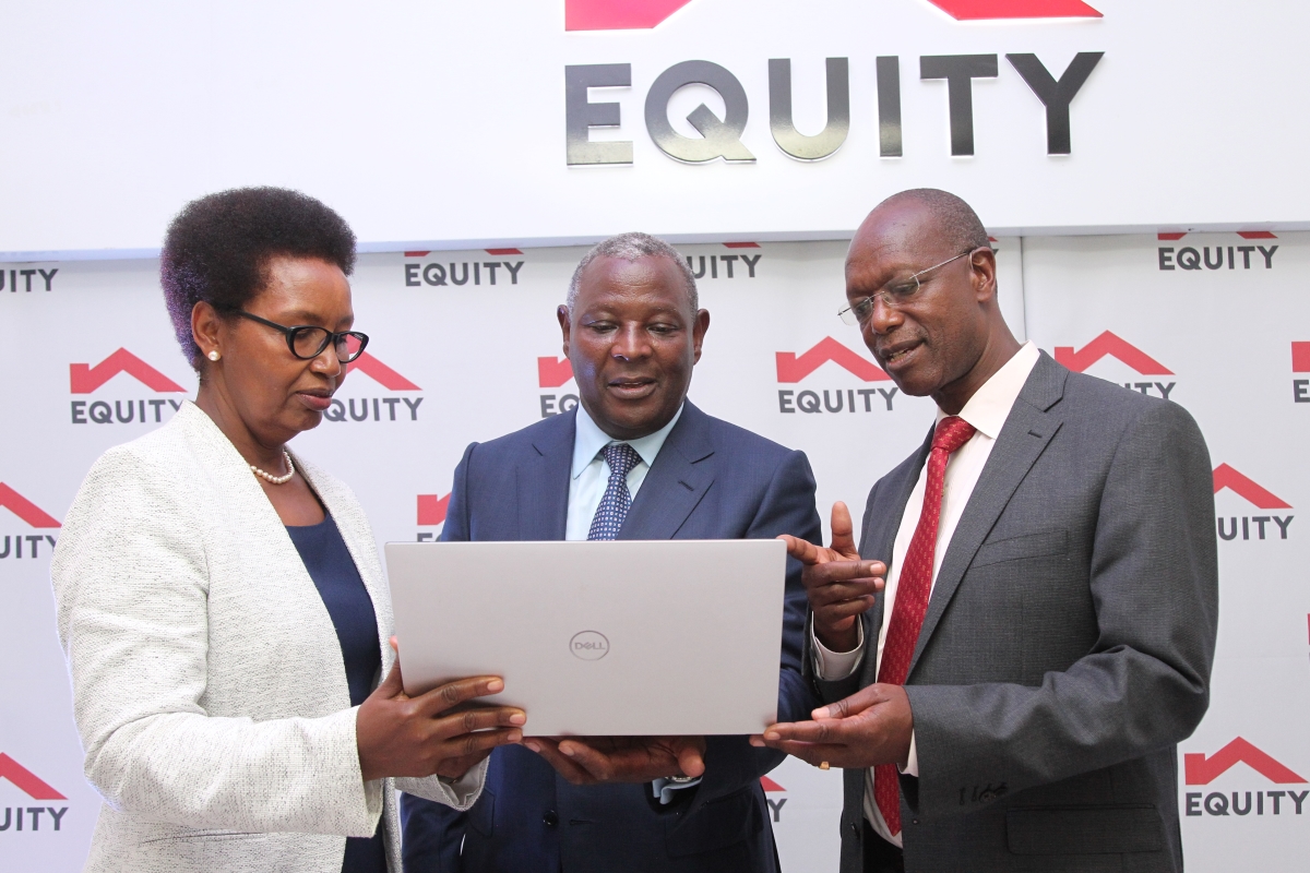 Evelyn Rutagwenda, Equity Group Board Vice – Chair (left), Dr. James Mwangi, Equity Group Managing Director and CEO (centre) and Prof. Isaac Macharia, Equity Group Board Chairman (right) engage during the 2022 quarter one investor briefing and release of financial results.